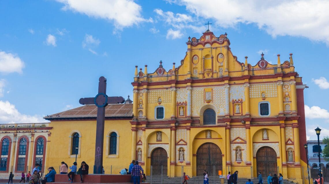 a group of people standing in front of a church