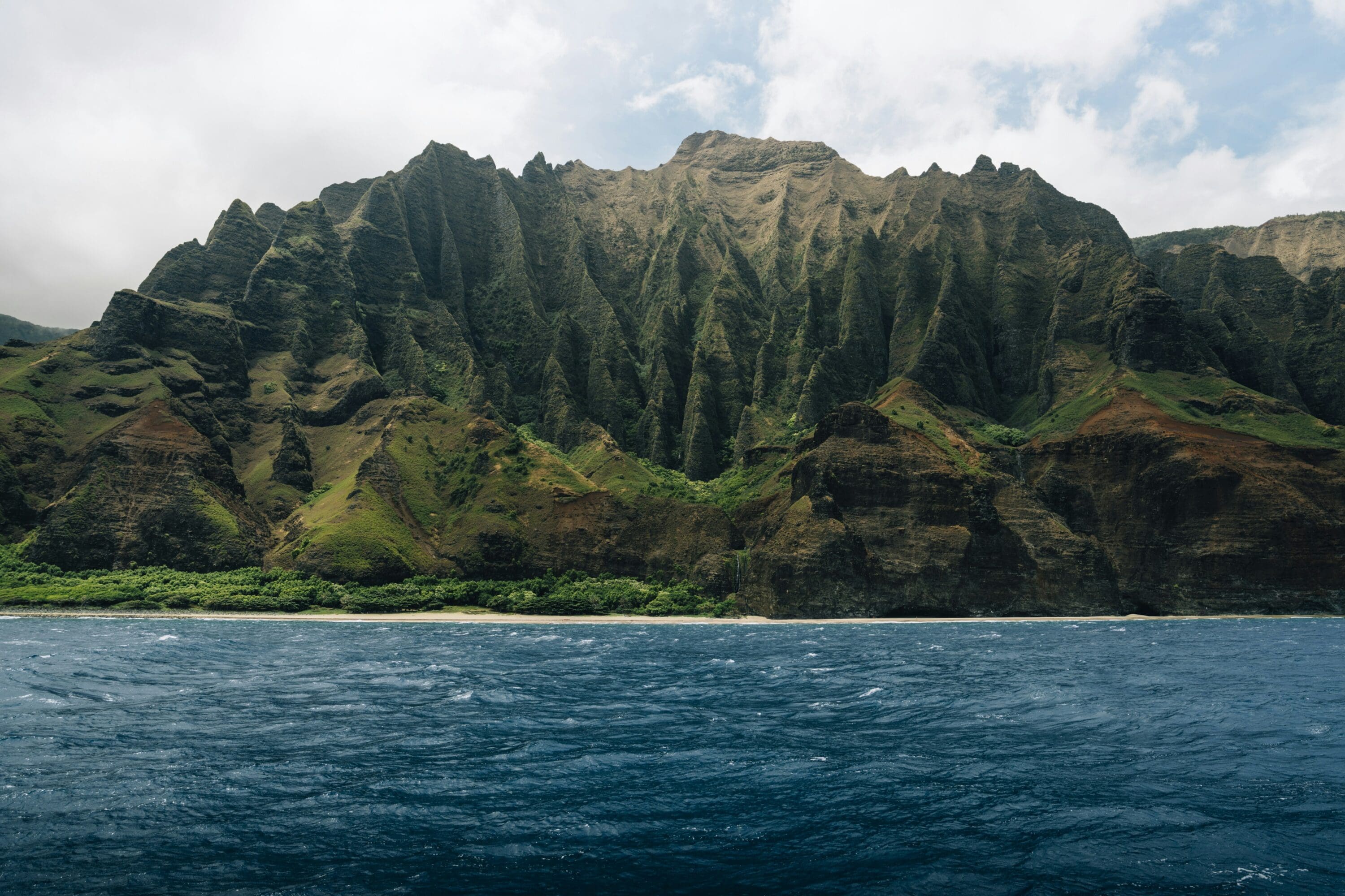 a mountain with a body of water in front of it