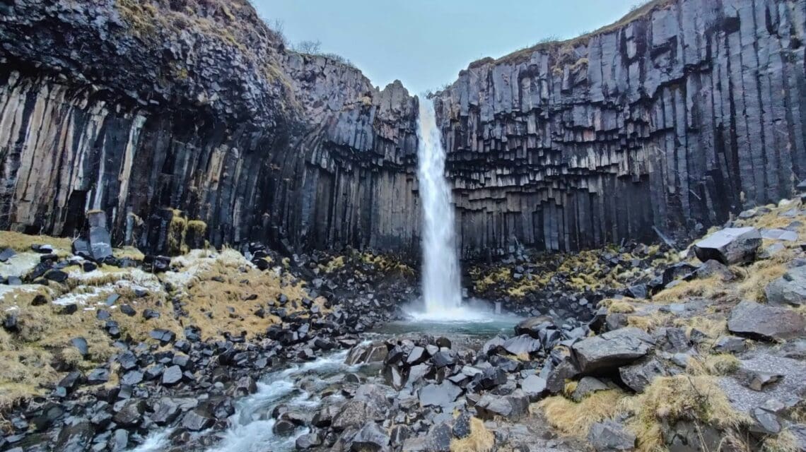 a waterfall in a rocky area
