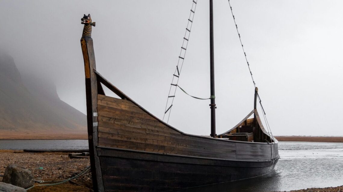 Abandoned Viking boat in foggy landscape, Iceland.