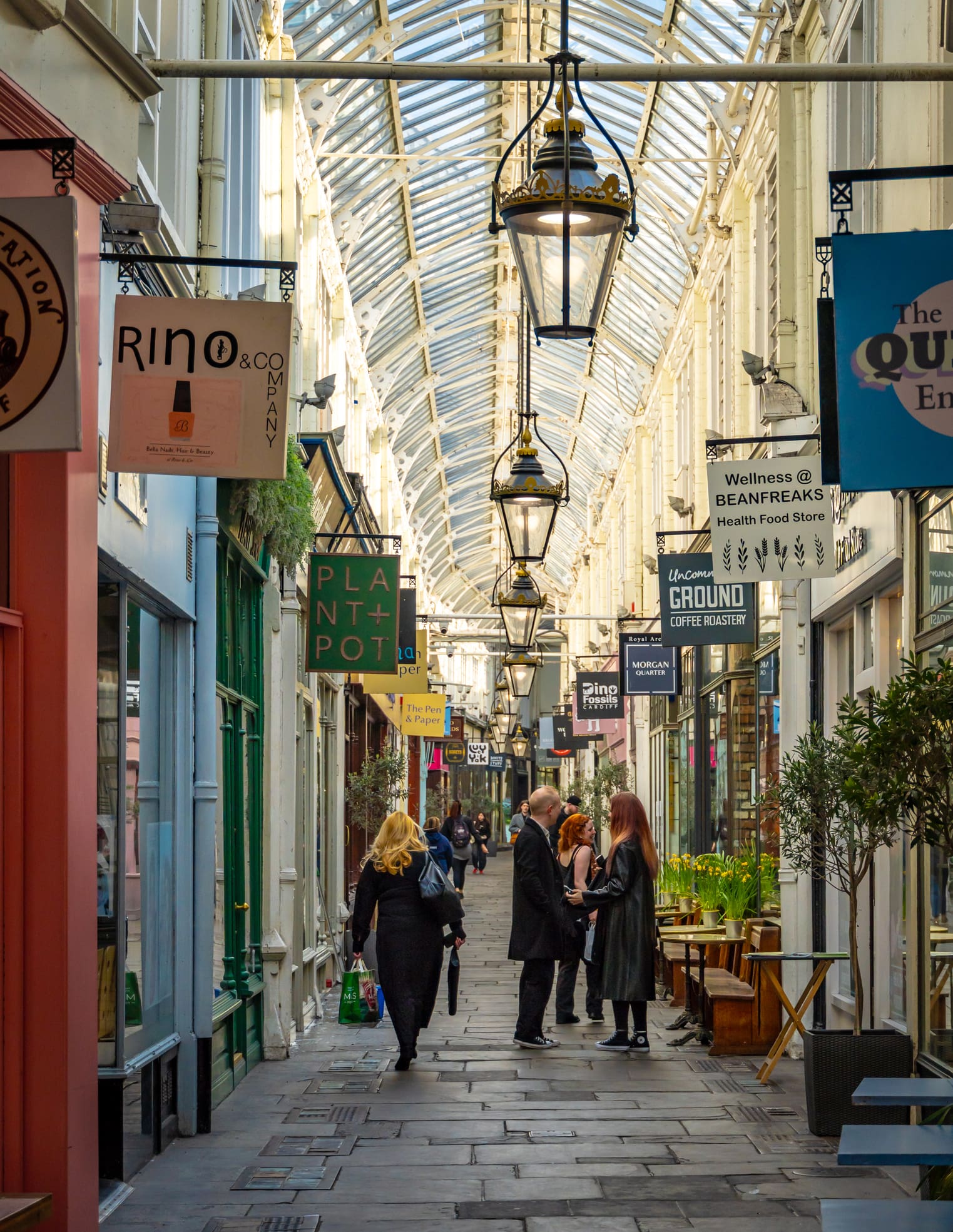 Shoppers in a Victorian covered arcade in Cardiff