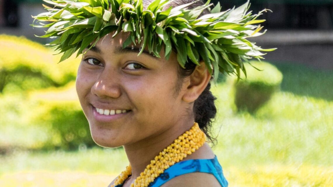 Local Polynesian woman with a woven head piece