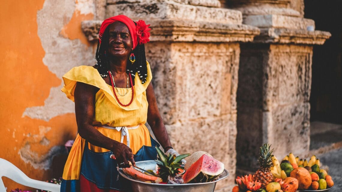 standing woman wearing yellow dress during daytime