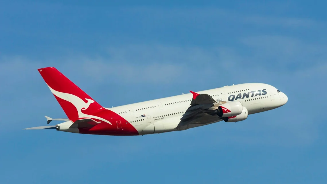 Qantas airplane flying through clear skies