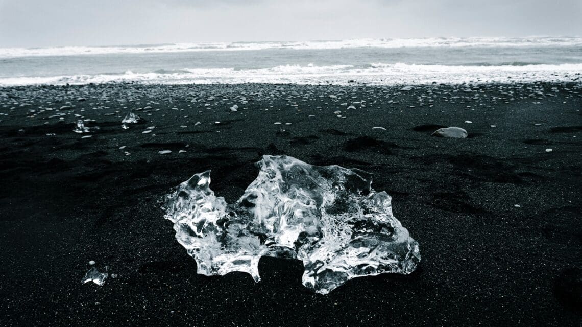 Large chunk of ice on a black sand beach